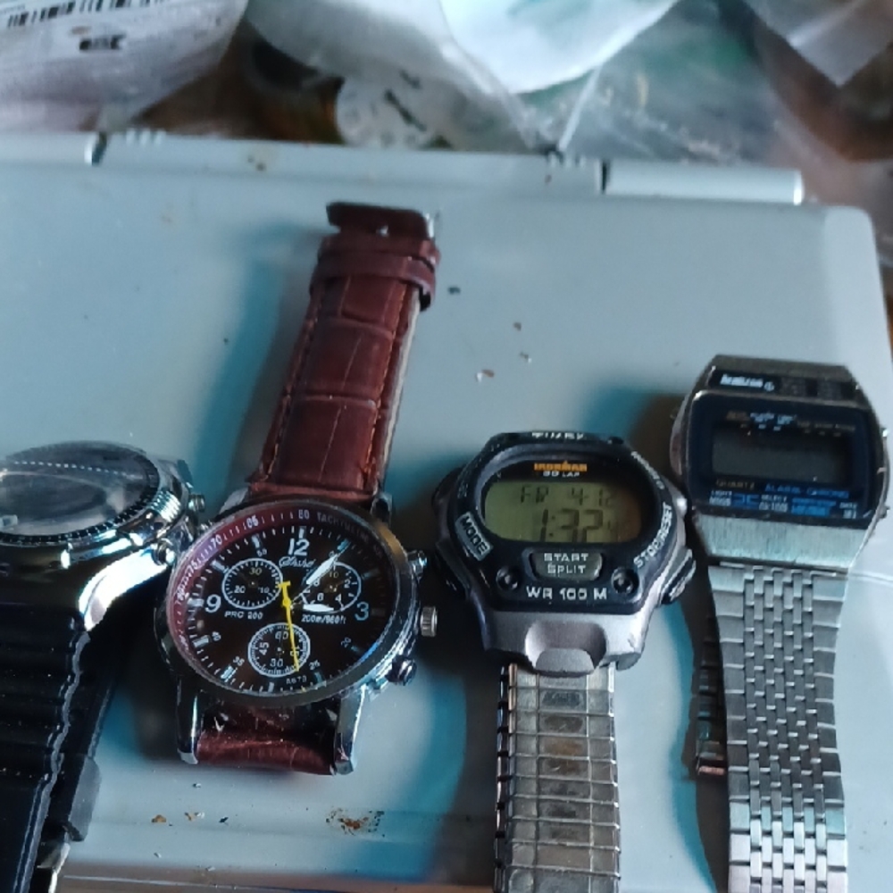 Assorted Silver and Brown Watch Collection(4)